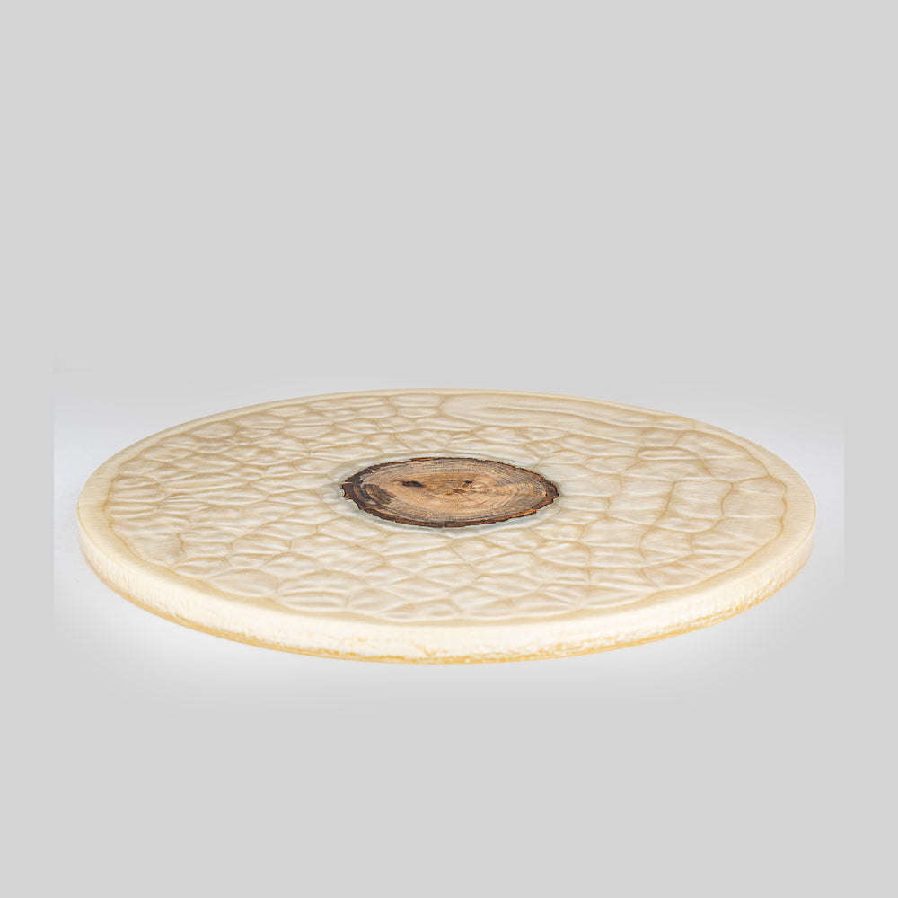 Cheese board with unique organic patterns, perfect for serving appetizers.