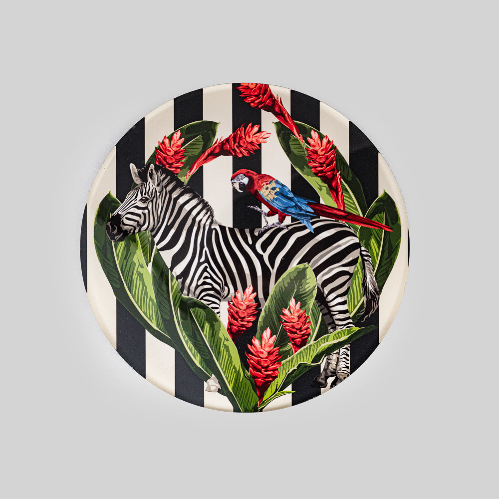 Bold zebra pattern on a colorful plexiglass trivet
