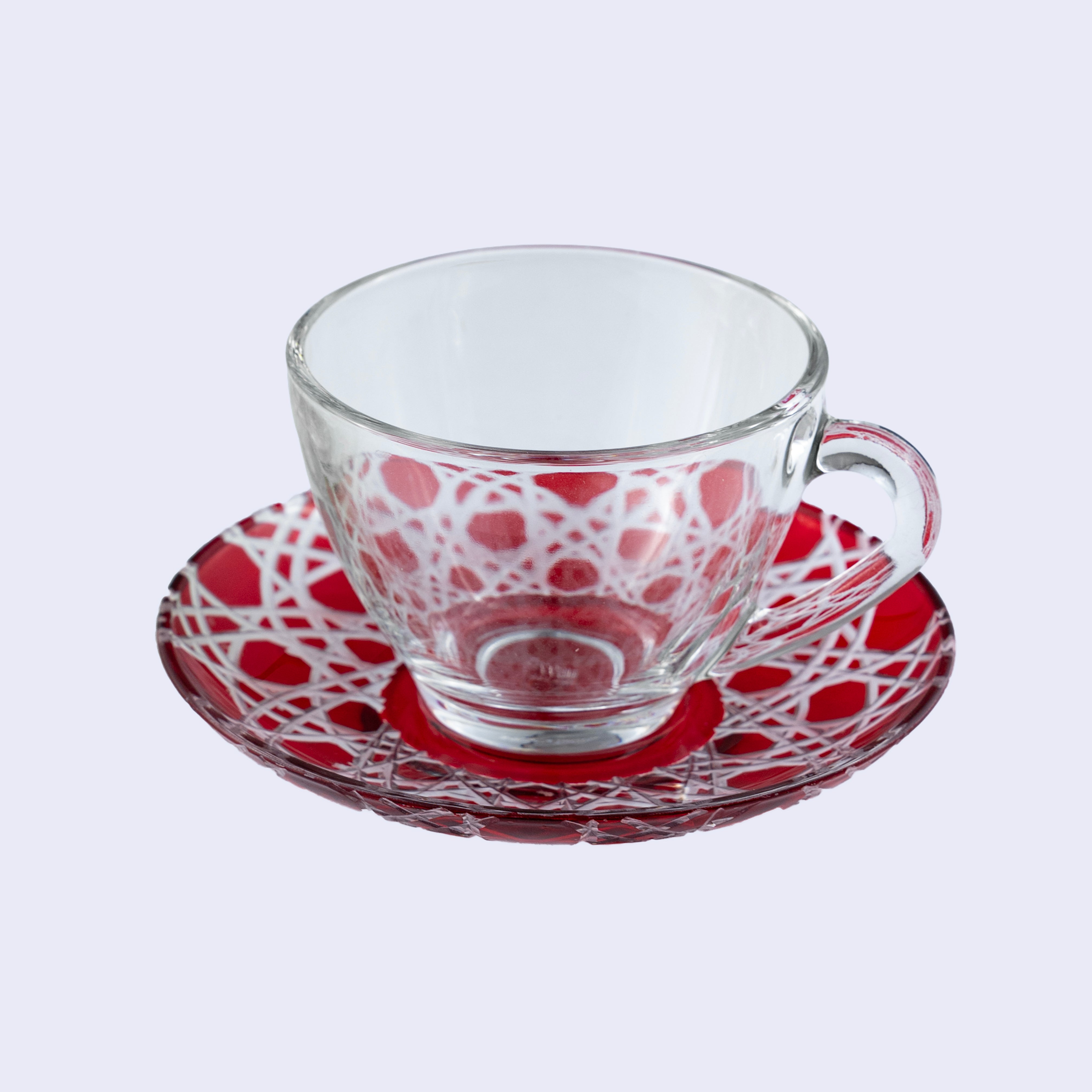 tyetye handcut green glass saucer showing cut-to-clear lattice pattern, close-up view — India