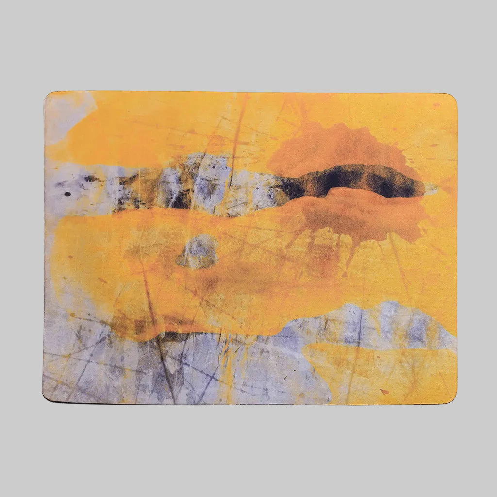 "A bright yellow placemat from the Art Series, featuring a textured surface and artistic design, perfect for adding a pop of color to any dining table."