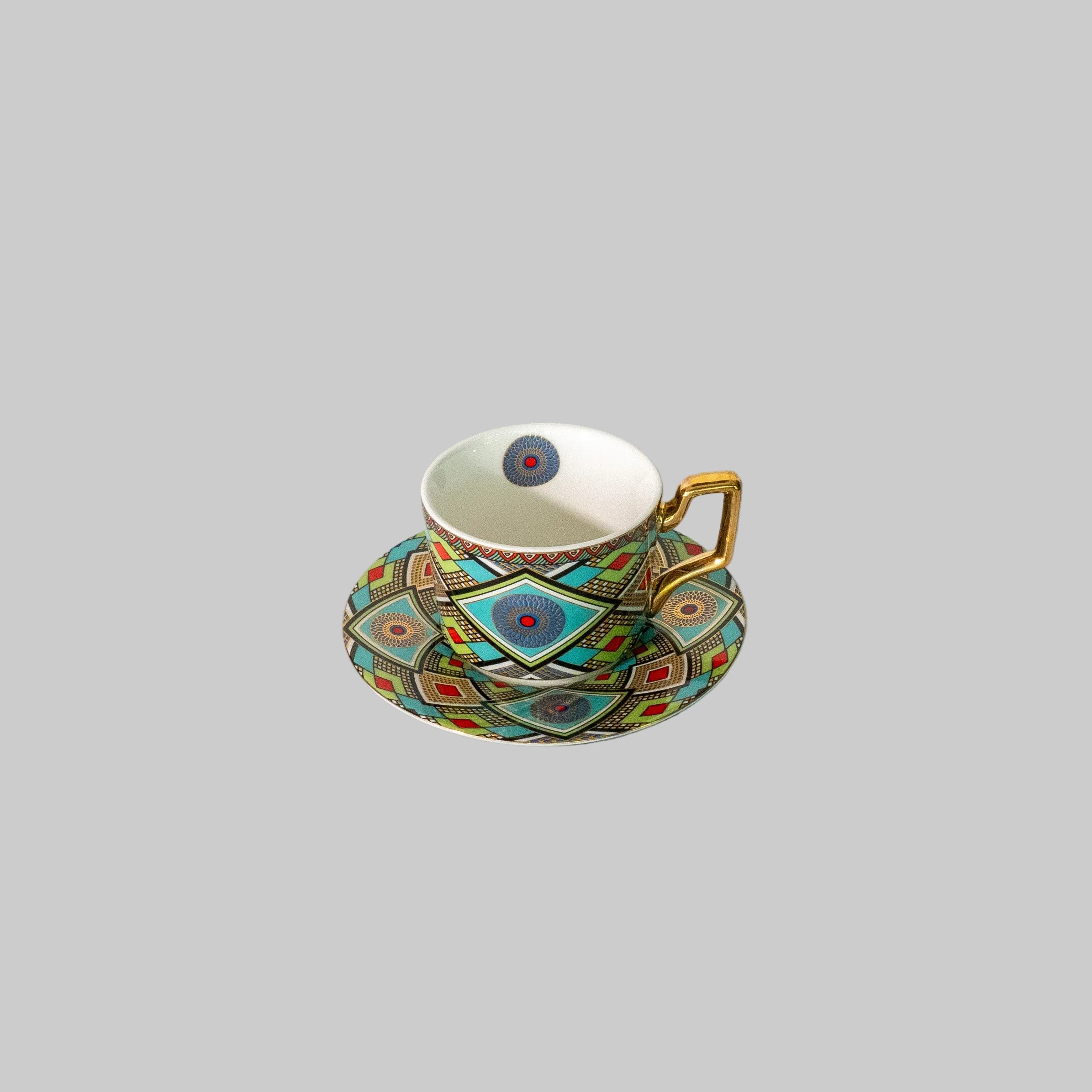 "Moroccan mosaic tea and coffee set beautifully arranged on a rustic wooden table."
