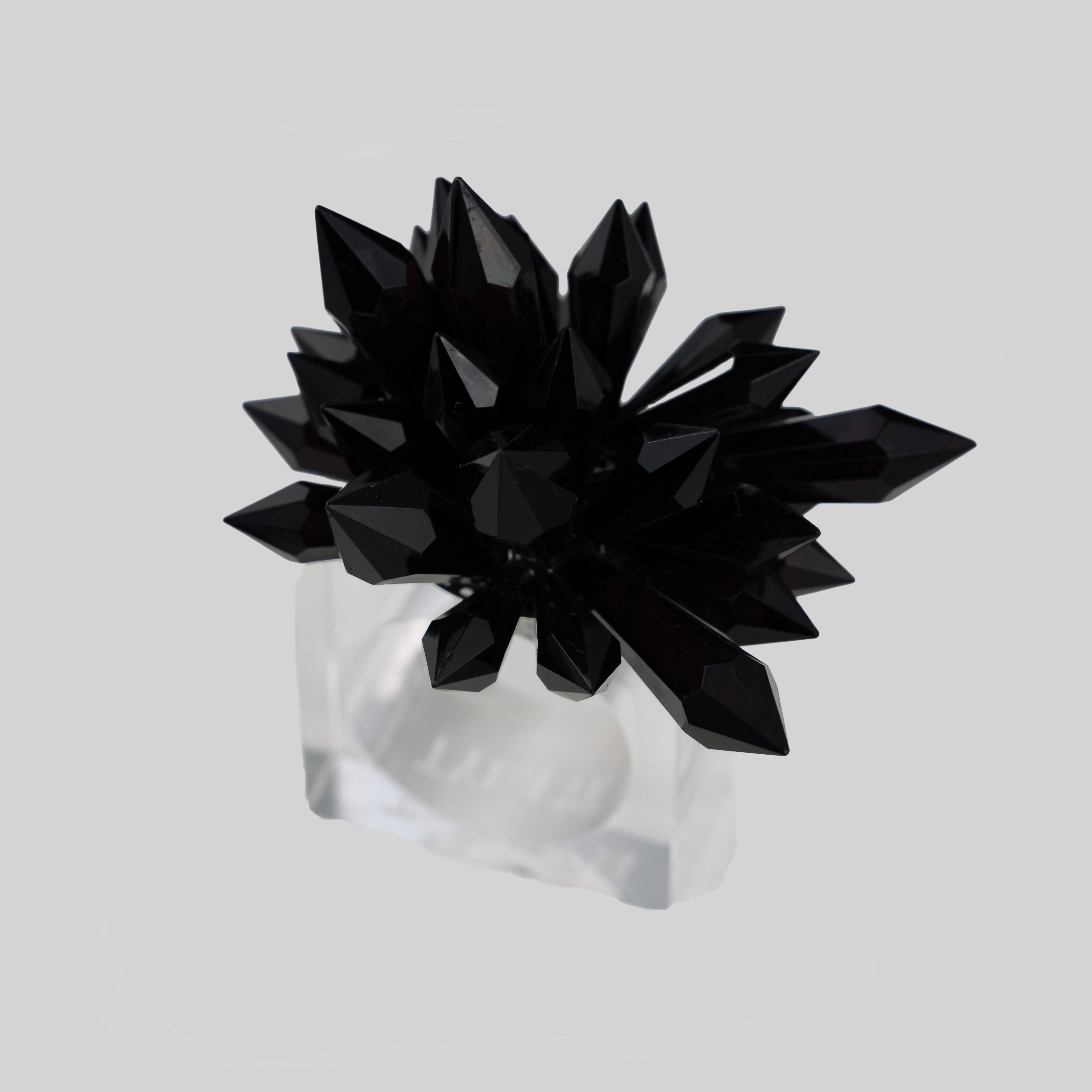 Black geometric crystal spike napkin ring on clear acrylic band — tyetye India luxury tableware
