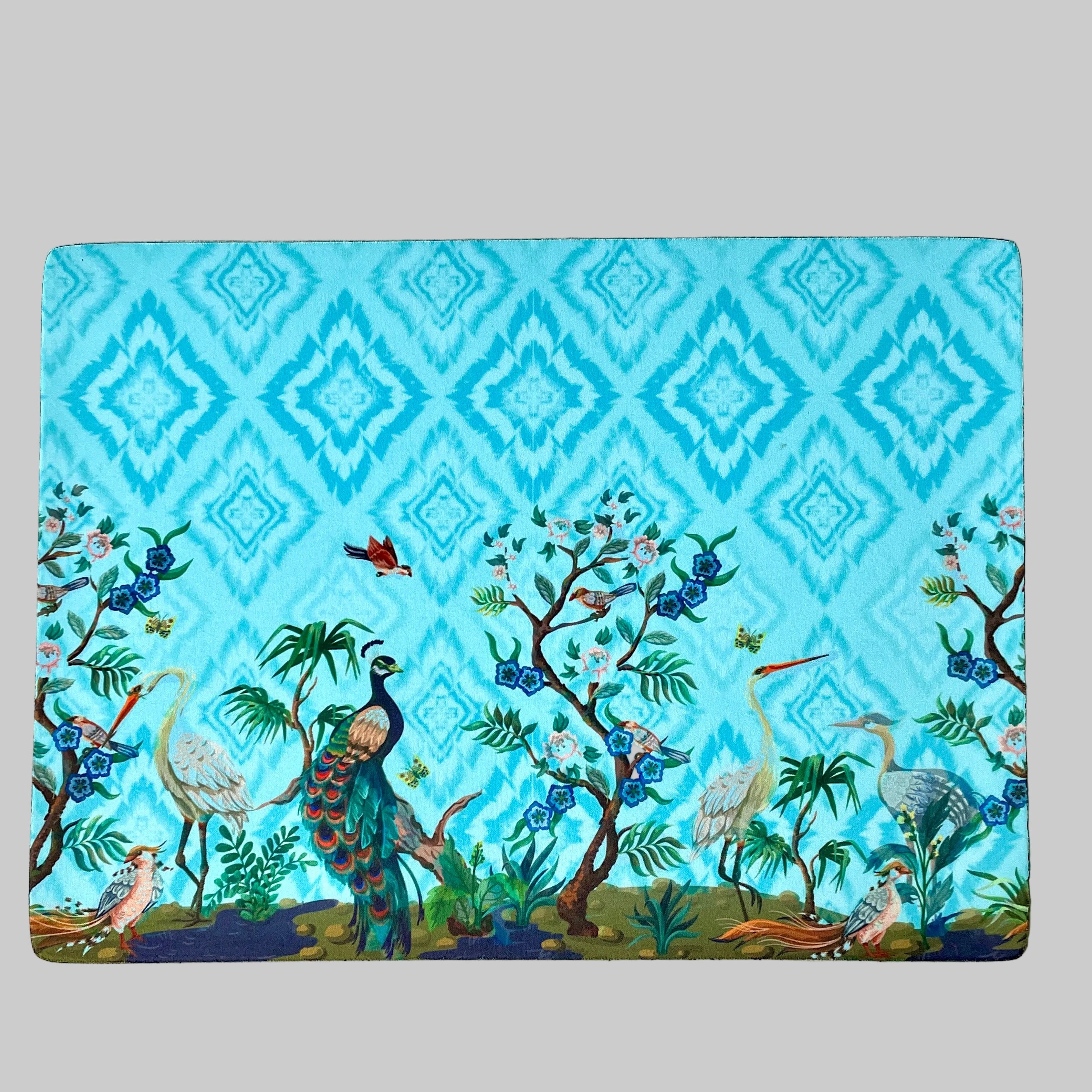 "Colorful Concert of Birds tablemats showcasing vibrant bird illustrations in a nature-inspired design."