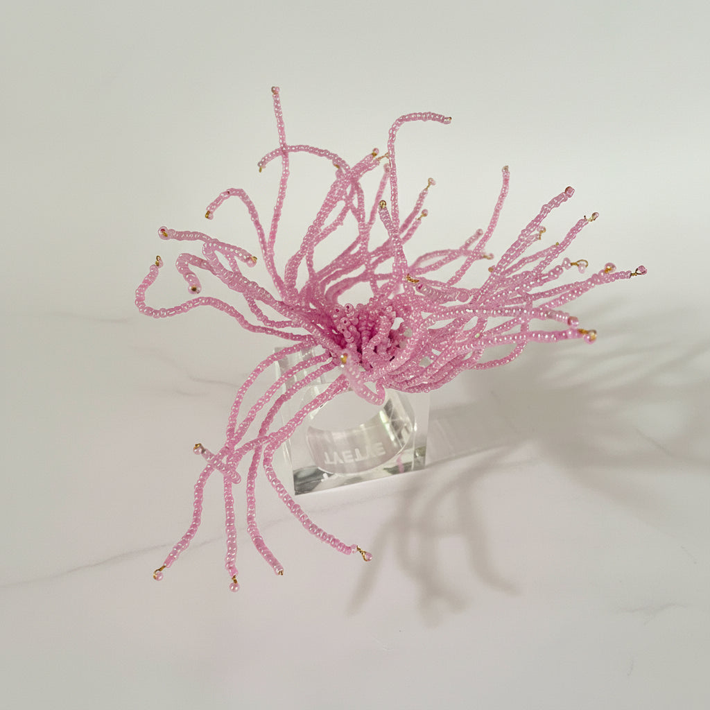 Elegant napkin rings adorned with delicate pink beads, perfect for enhancing table settings.