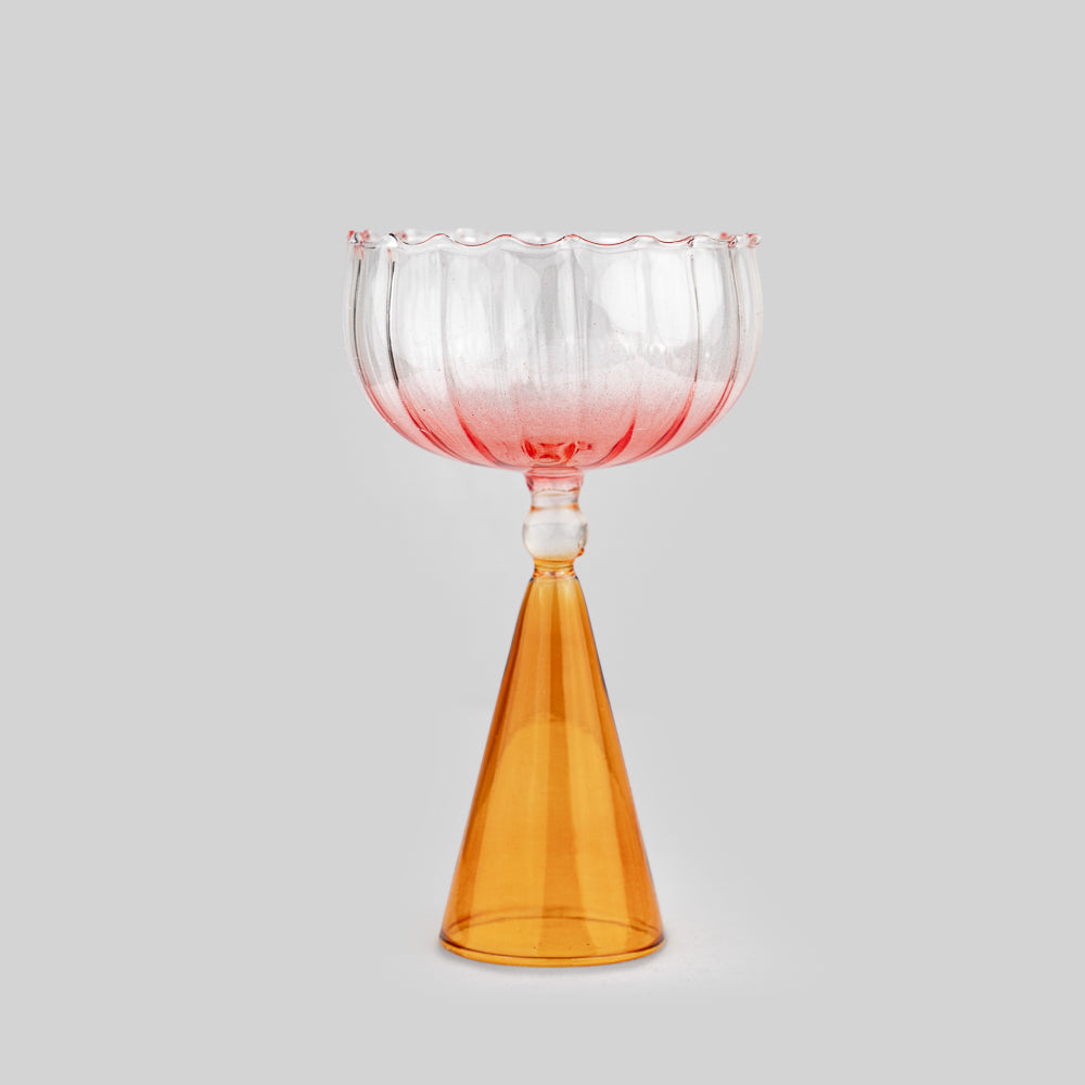"Colorful coupette glass adding flair to any gathering."