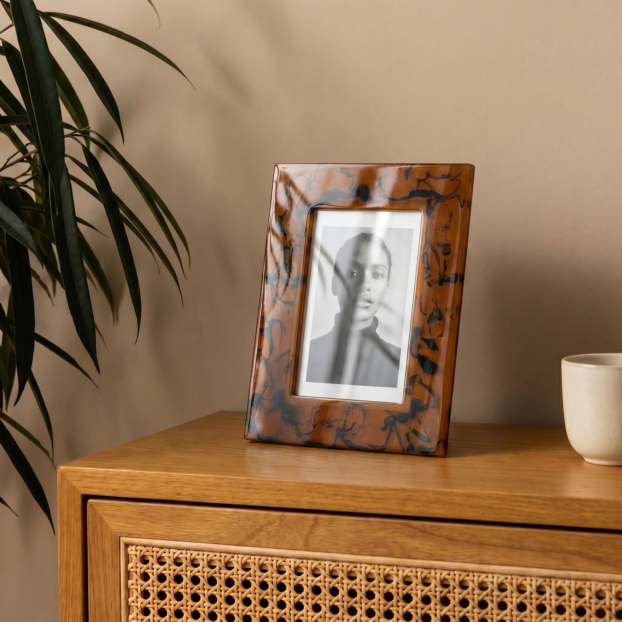 "Tyetye Tiger Shell acrylic photo frame displayed on vintage-style tabletop decor"
