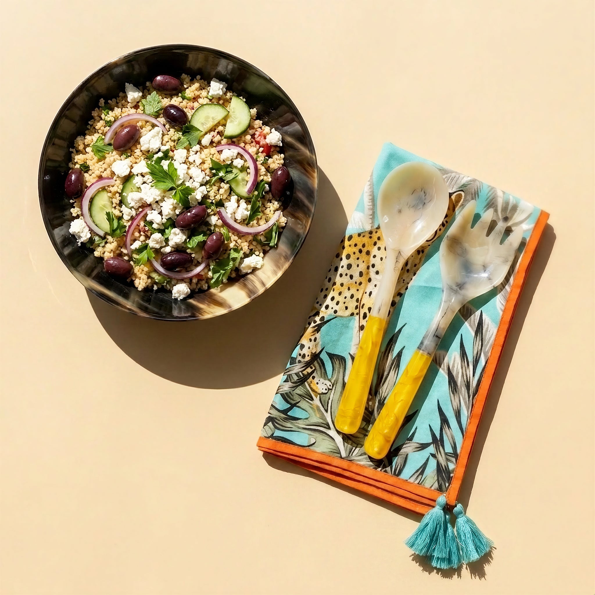 "Tyetye leopard and palm print dinner napkin with turquoise tassel trim"