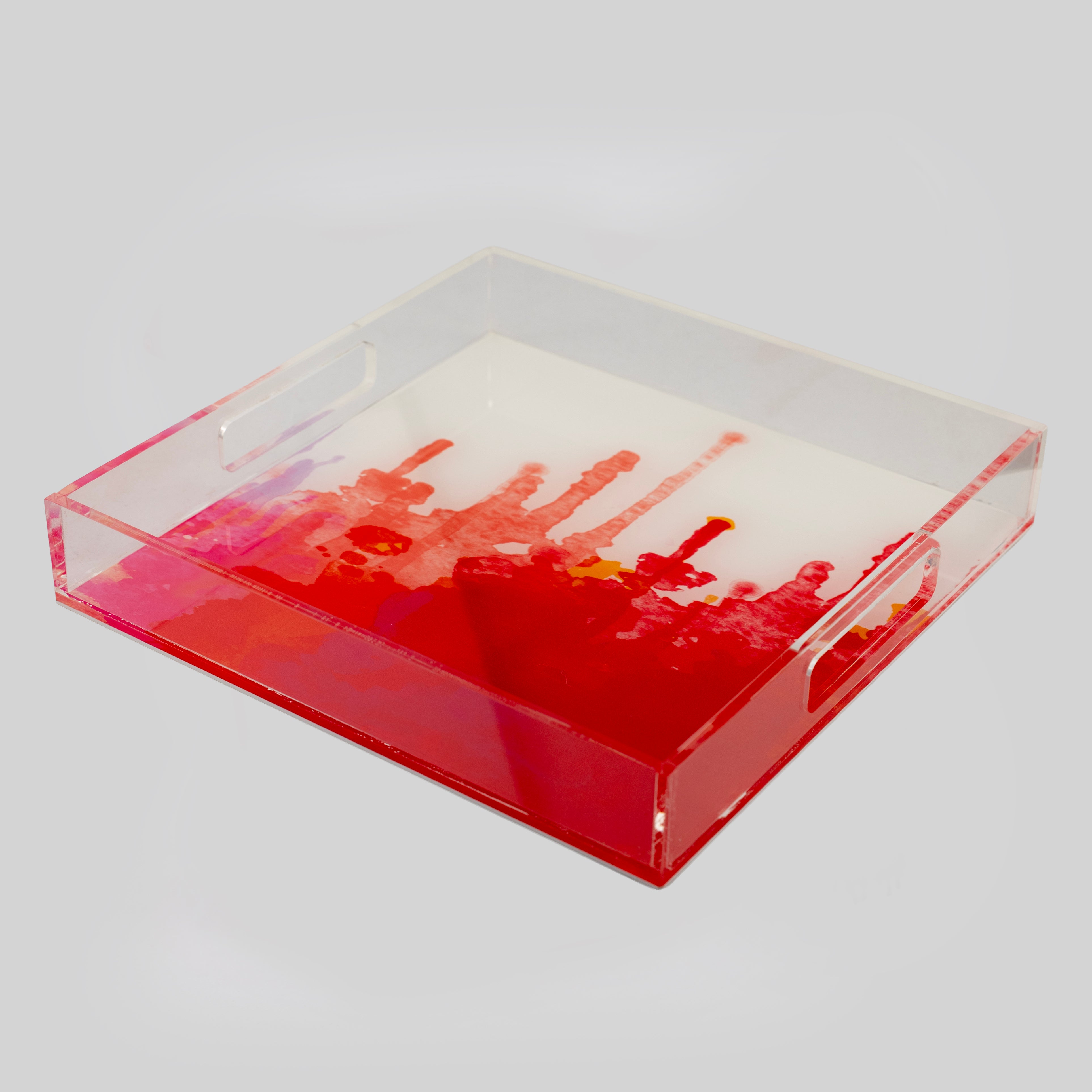 Square clear acrylic tray with bold red pink and amber watercolour splash design and cut-out handles